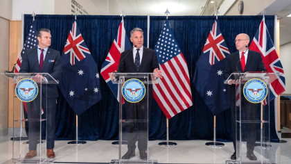 U.K. Defence Secretary John Healey, right, listens as Australia's Deputy Prime Minister and Minister for Defence Richard Marles, center, speaks alongside U.S. Secretary of Defense Pete Hegseth, left, during the AUKUS defense ministers' meeting at the Pentagon in Washington, Wednesday, Dec. 10, 2025. (AP Photo/Mark Schiefelbein)