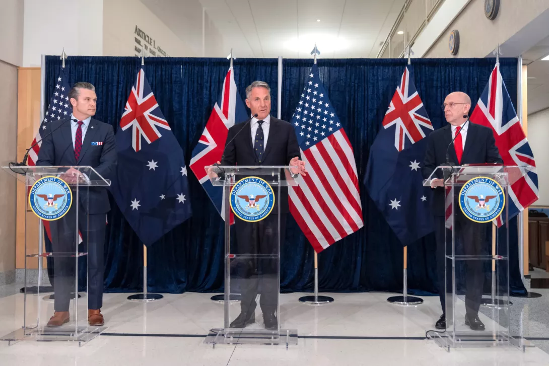 U.K. Defence Secretary John Healey, right, listens as Australia's Deputy Prime Minister and Minister for Defence Richard Marles, center, speaks alongside U.S. Secretary of Defense Pete Hegseth, left, during the AUKUS defense ministers' meeting at the Pentagon in Washington, Wednesday, Dec. 10, 2025. (AP Photo/Mark Schiefelbein)